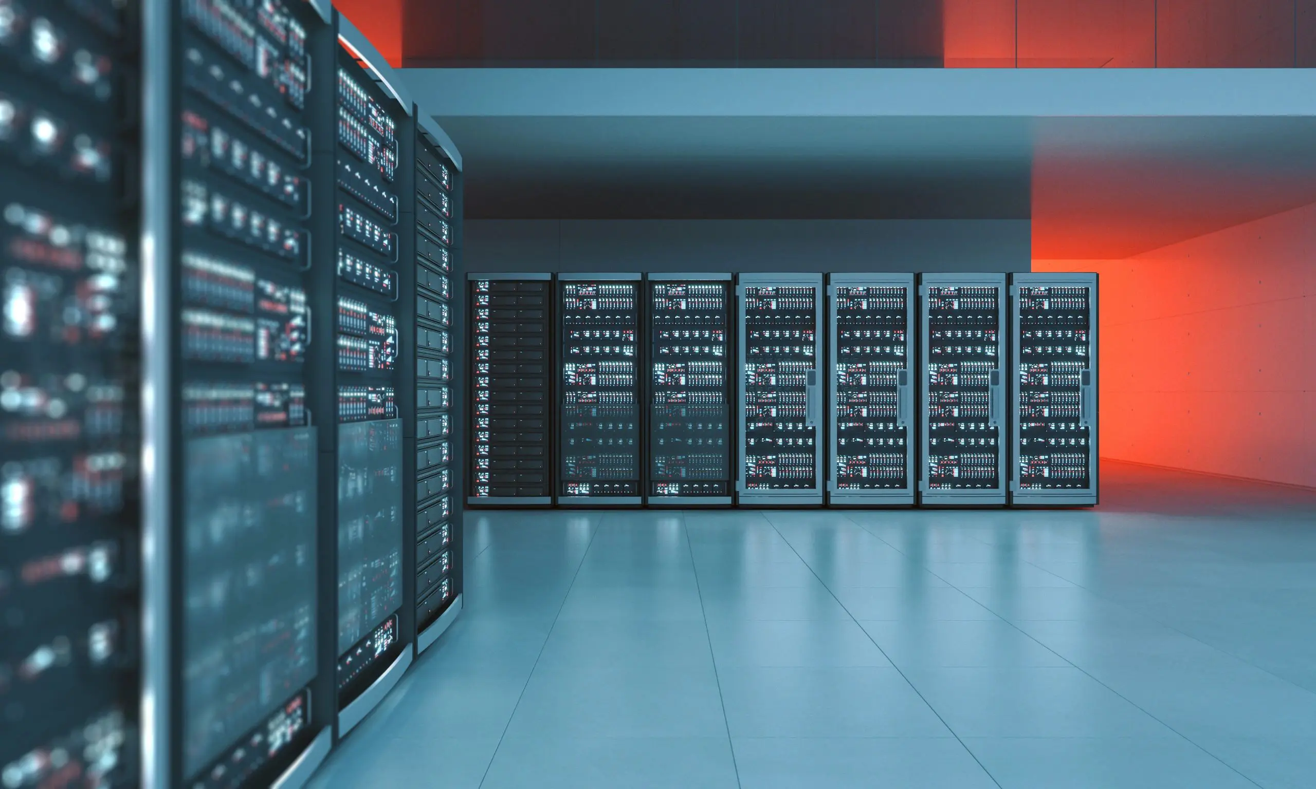 Server room with glowing red lights.