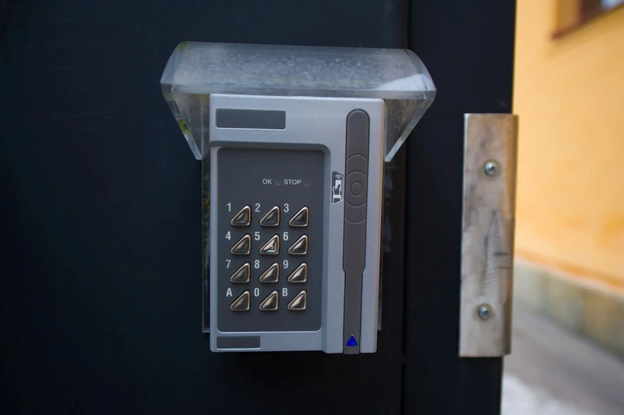 Keypad entry system on a metal door.