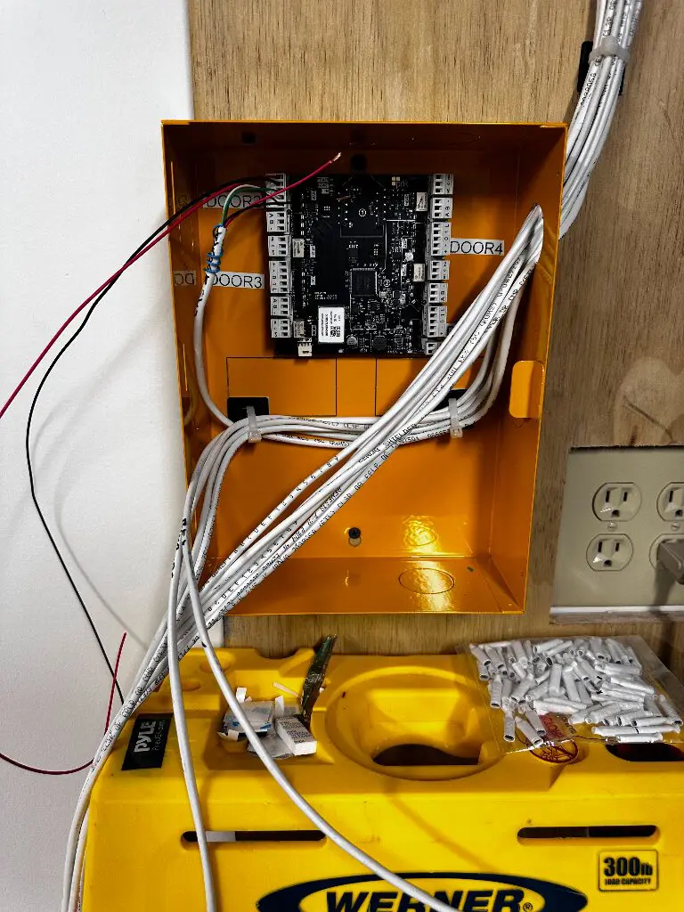 Orange electrical box with circuit board, cables