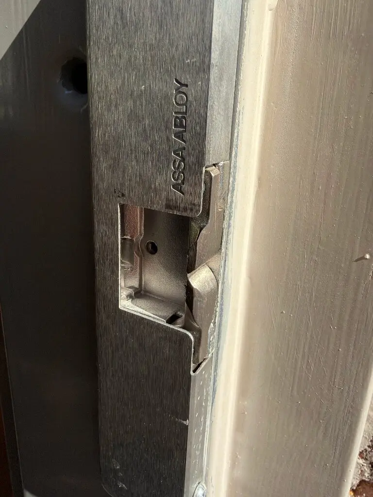 Close-up of ASSA ABLOY door strike plate