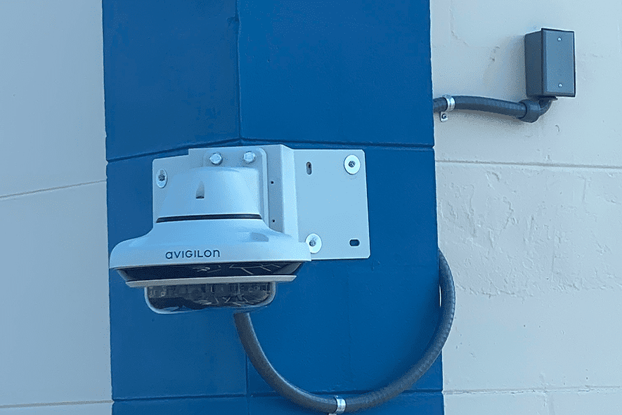 Avigilon surveillance camera mounted on blue column