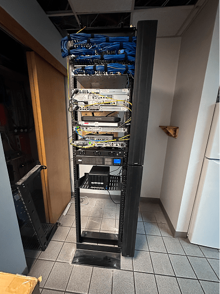 Network equipment rack with blue patch cables