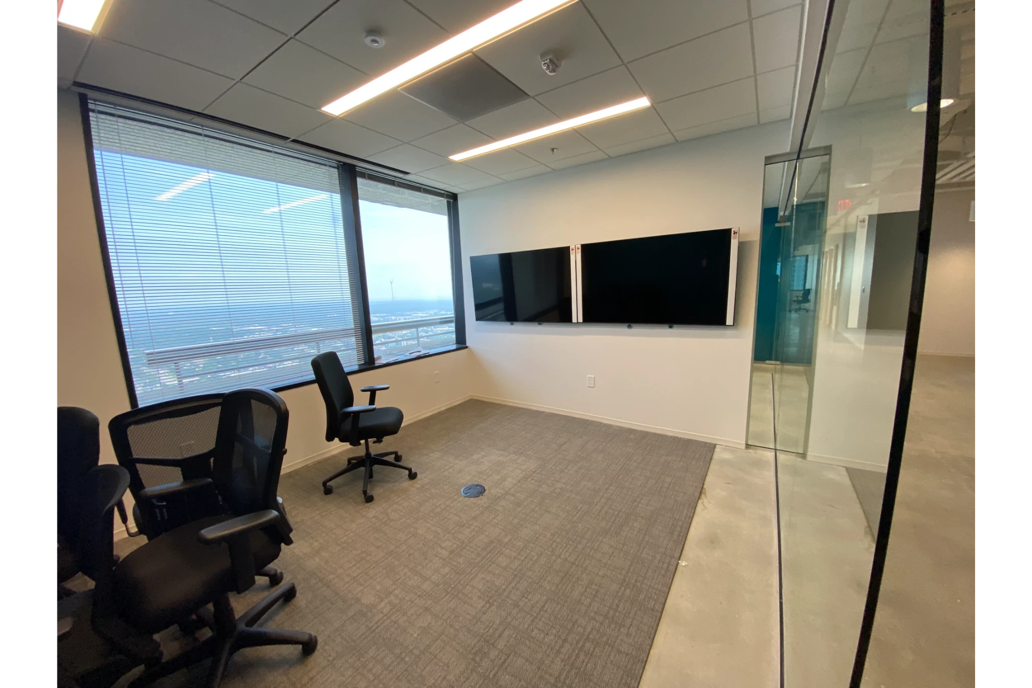 Empty modern office conference room with screens