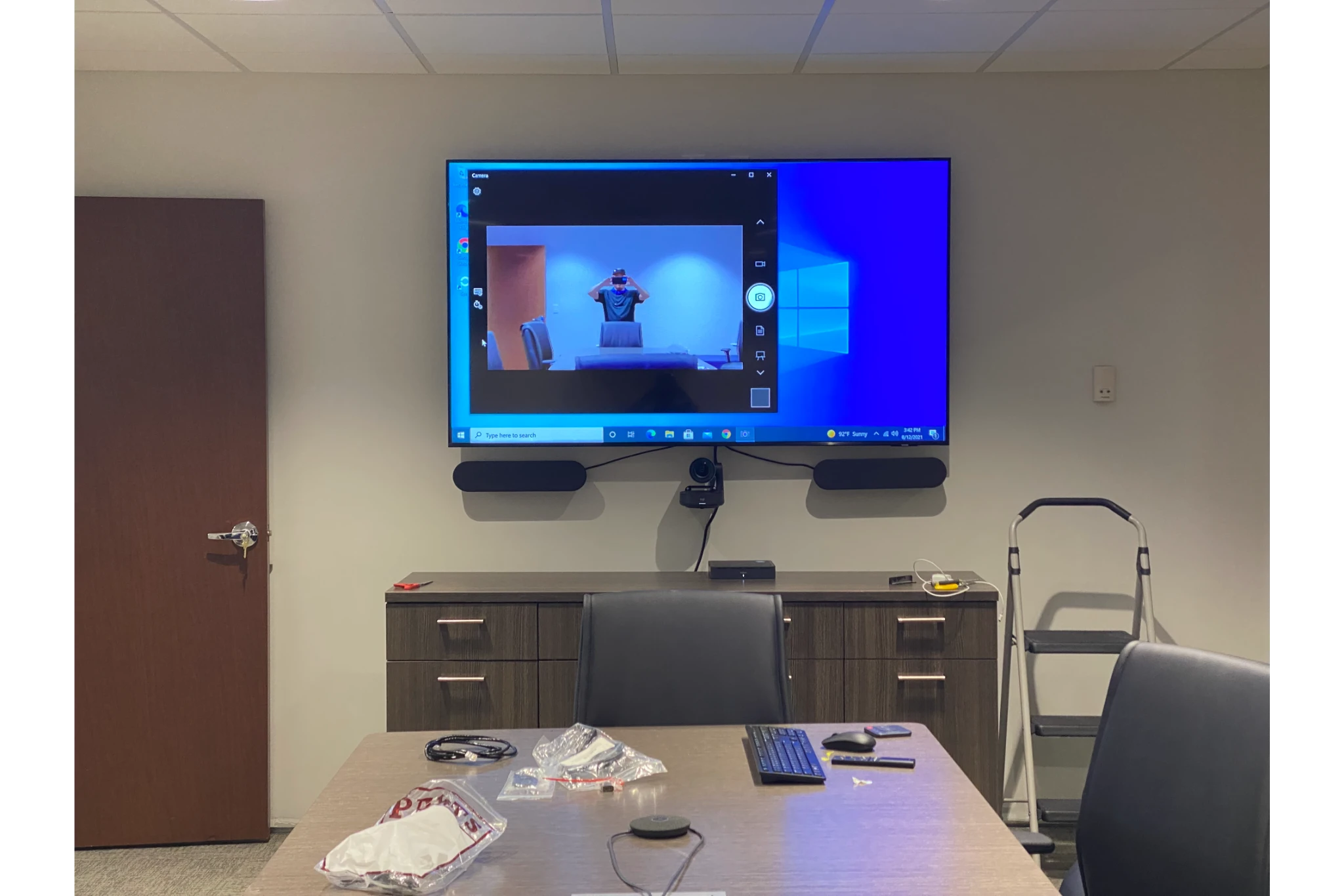 Conference room with video conferencing screen