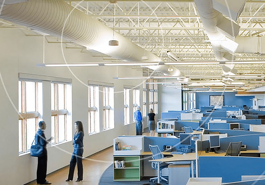 Modern open plan office with blue cubicles