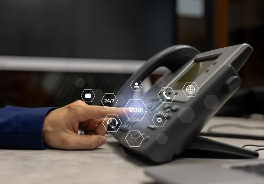Hand interacting with a VOIP phone interface.